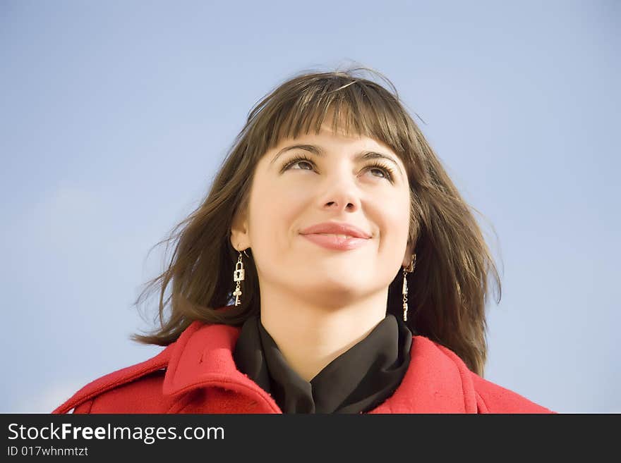 Pretty Girl Portrait On The Sky Background