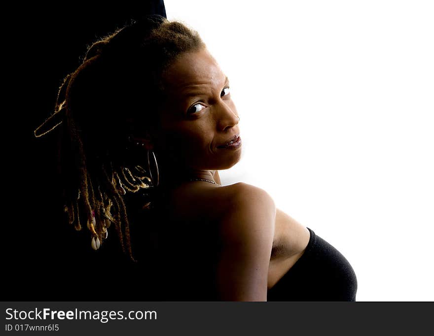 African American woman with dreadlocks against black and white wall. African American woman with dreadlocks against black and white wall