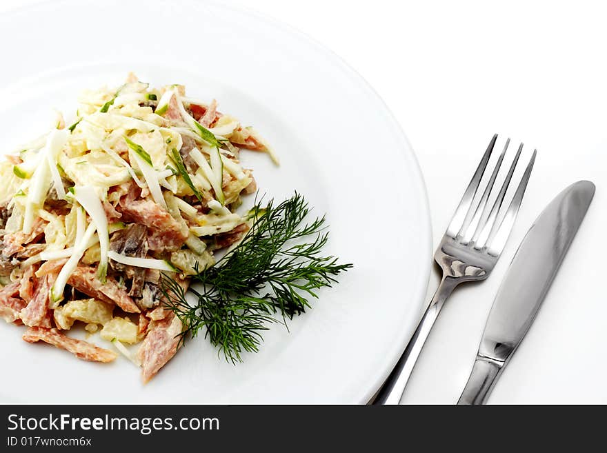 Salad Comprises Chopped Ham, Cucumber and Cheese Dressed Dill. Isolated on White Background