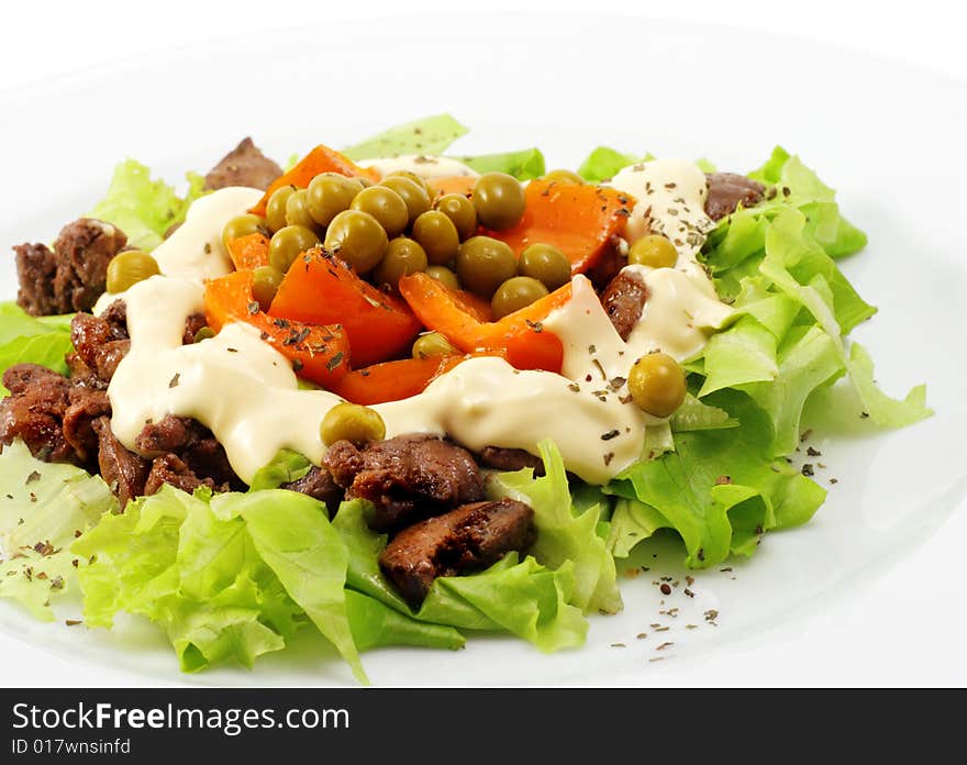 Chicken Salad Composed Chicken Liver and Pepper Dressed with Salad Leaves and Green Peas. Isolated on White Background