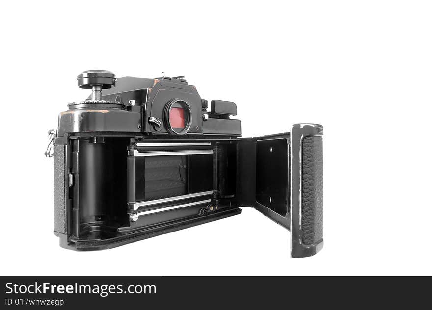 Vintage 1970's 35mm camera with open film loading door isolated on white. Vintage 1970's 35mm camera with open film loading door isolated on white