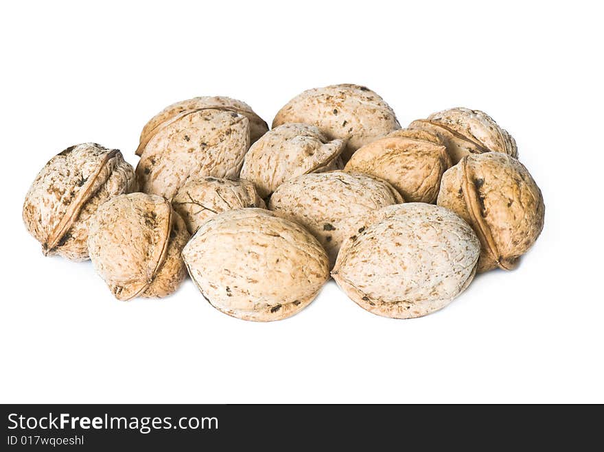 Walnuts in a shell on a white background