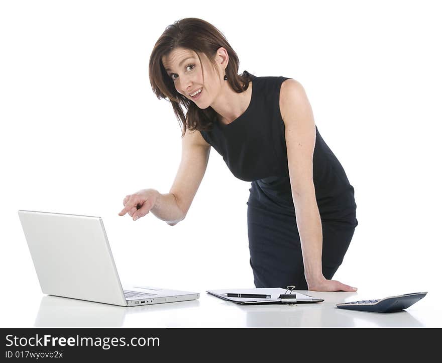 Beautiful businesswoman in her office indicating something on pc