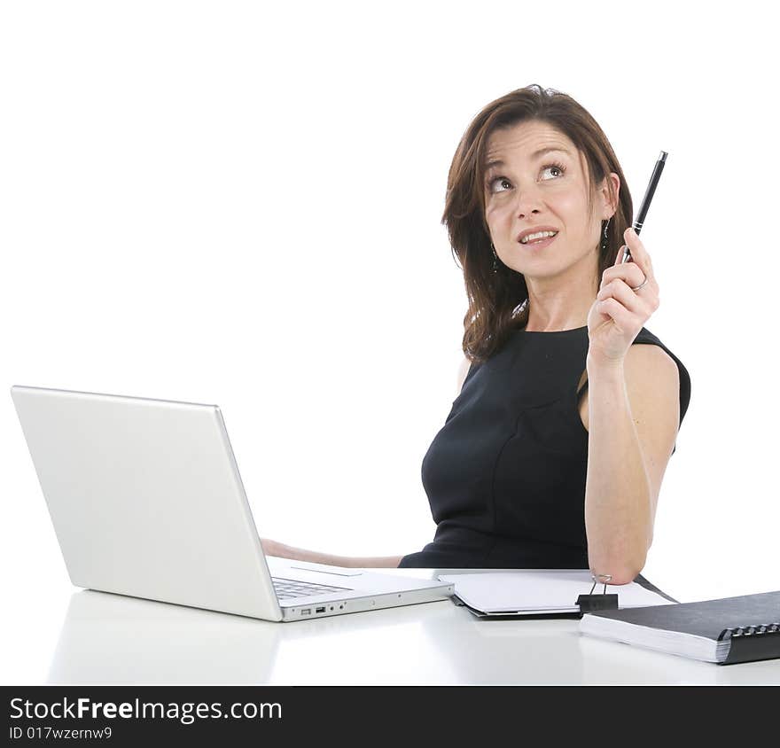 Determinated beautiful businesswoman with a pen in the hand