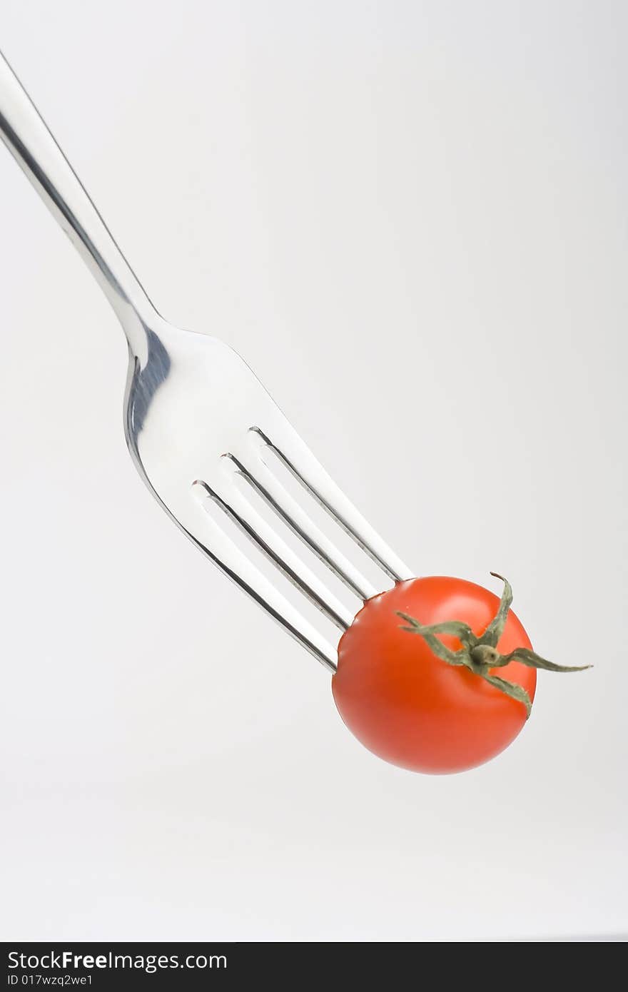 Fork with Fresh Salad isolated over white background. Fork with Fresh Salad isolated over white background