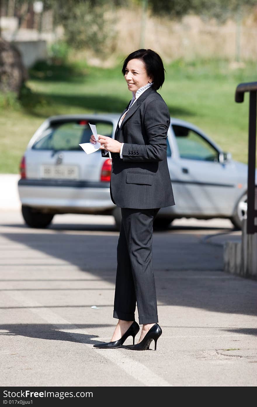 A business woman on the road in happy day of work. A business woman on the road in happy day of work