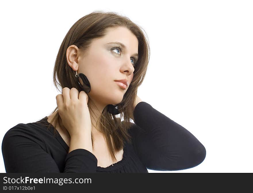 Closeup portrait of an attractive girl with black earrings on white background. Closeup portrait of an attractive girl with black earrings on white background