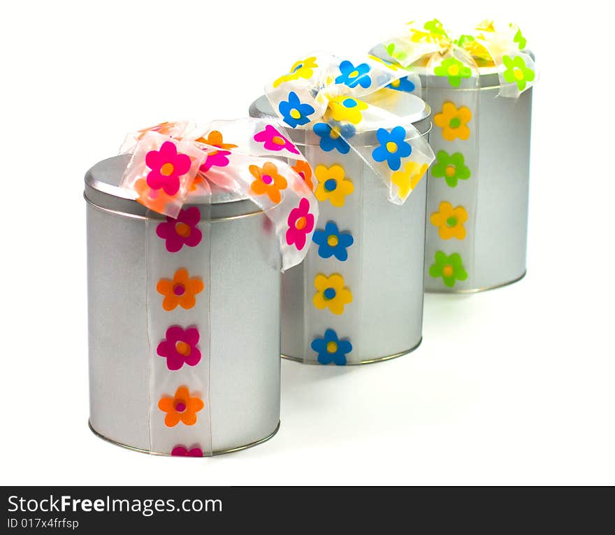 Tree beautiful metal gift boxes with colorful bows