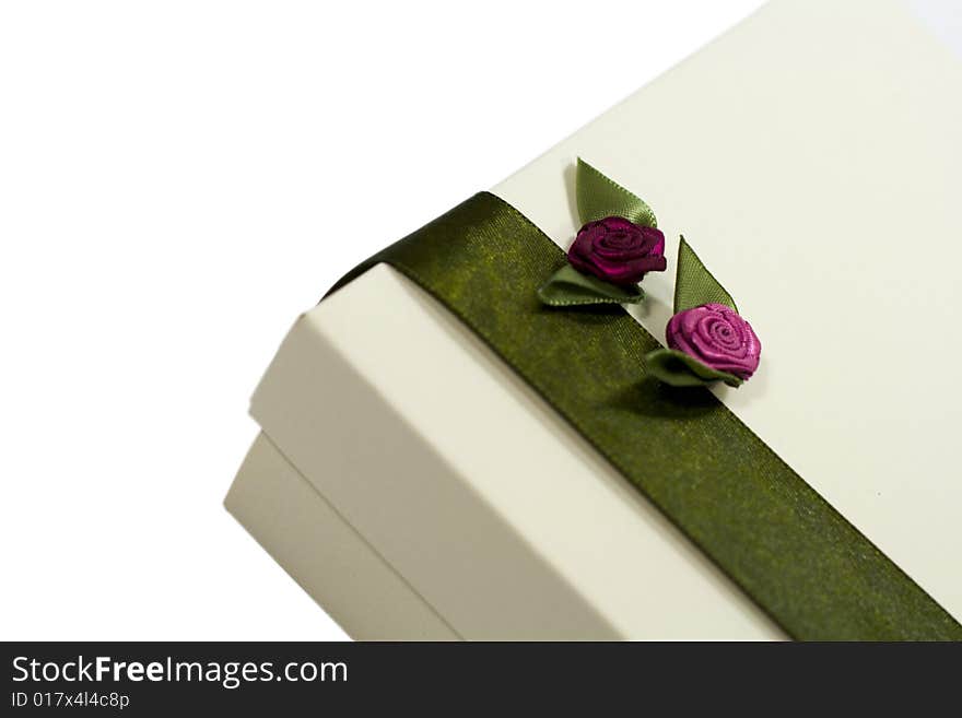 White gift box with green decoration