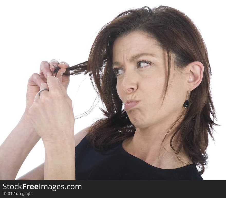 Forty years old woman watching her hair. Forty years old woman watching her hair