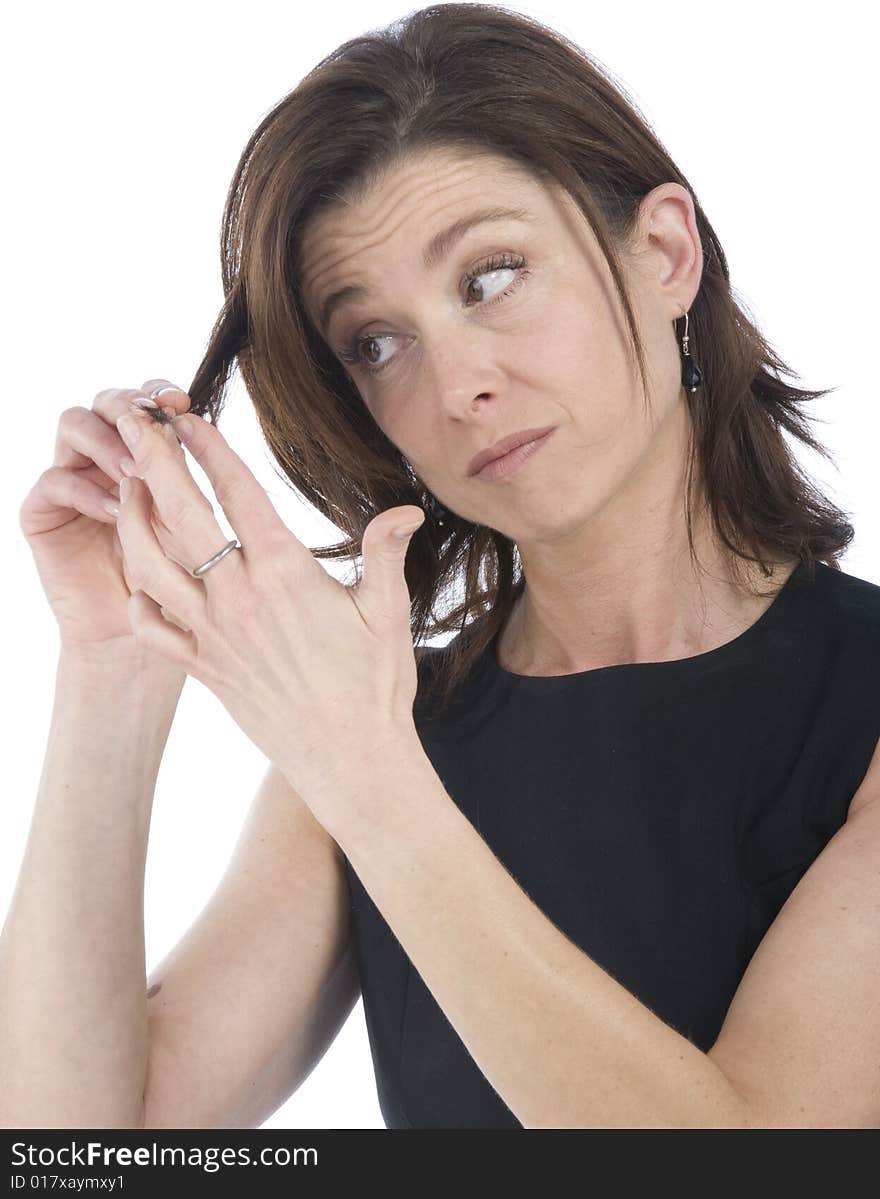 Forty years old woman watching her hair. Forty years old woman watching her hair