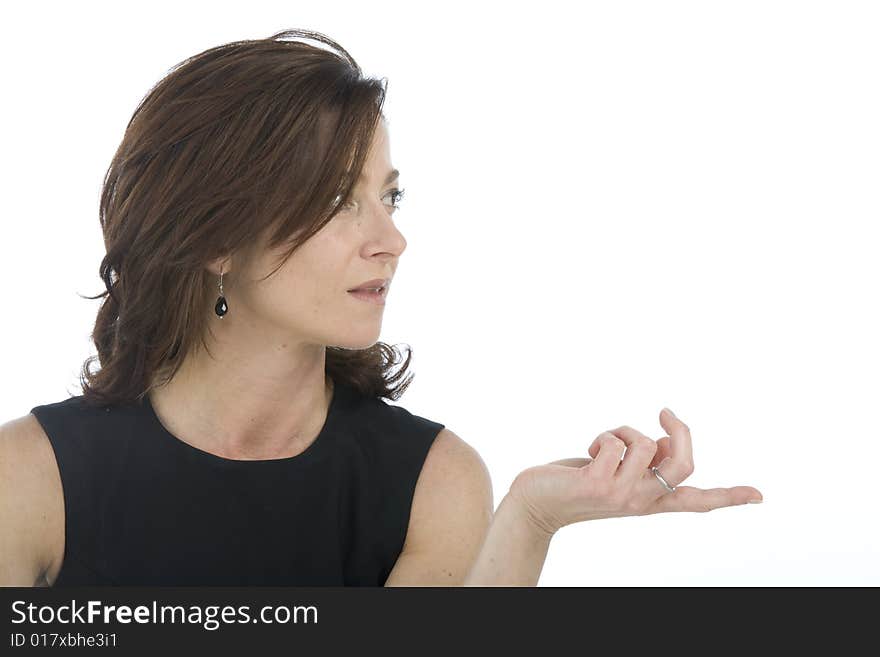 Portrait on white background of a forty years old woman in studio that indicates. Portrait on white background of a forty years old woman in studio that indicates