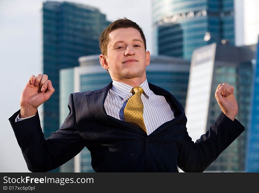 Businessman standing with outstretched arms