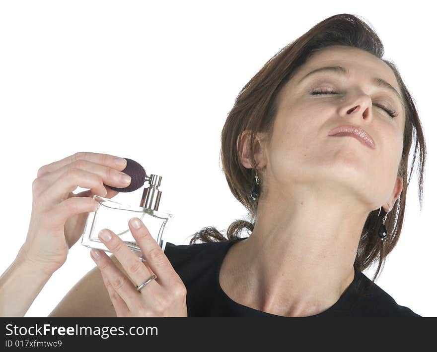 Sensual Woman Applying Perfume On Her Body