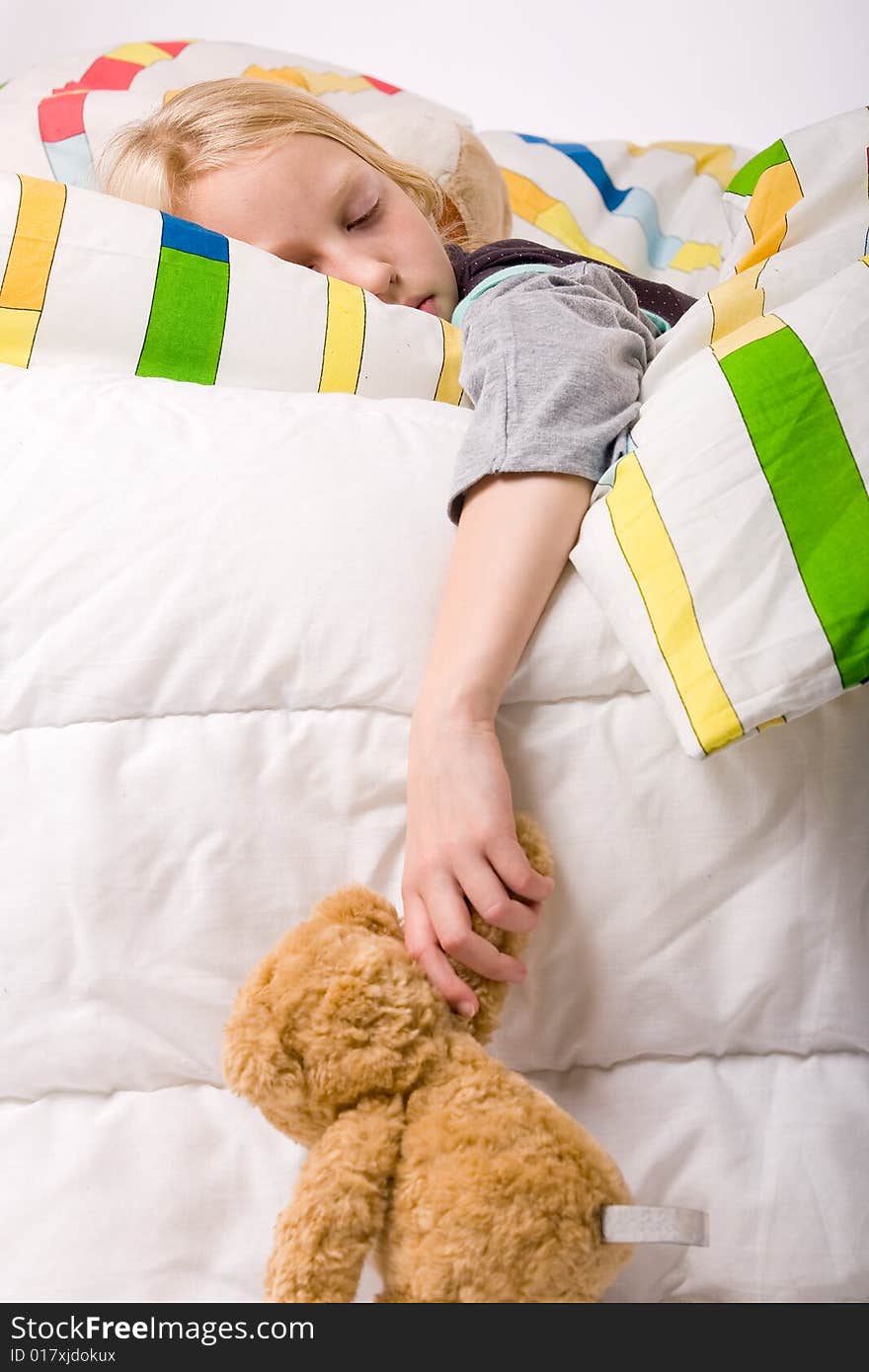 Sleeping young cute child in a colorful bed. Sleeping young cute child in a colorful bed