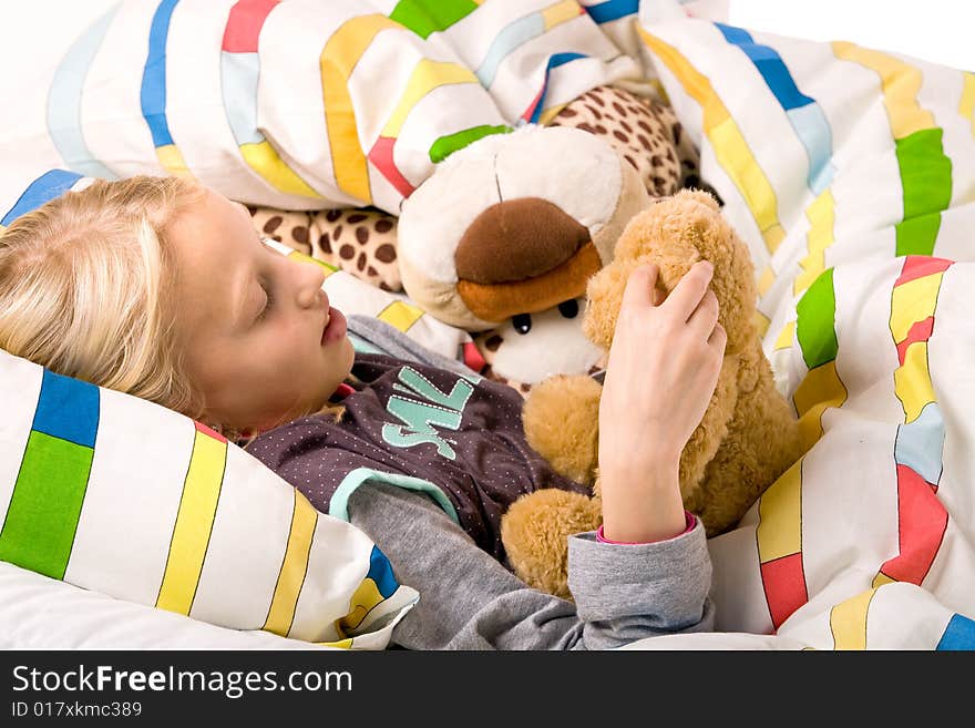 Sleeping young cute child in a colorful bed. Sleeping young cute child in a colorful bed