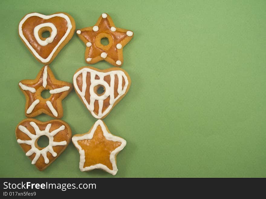 Gingerbread cookies in two lines against green background with ad space on right. Gingerbread cookies in two lines against green background with ad space on right