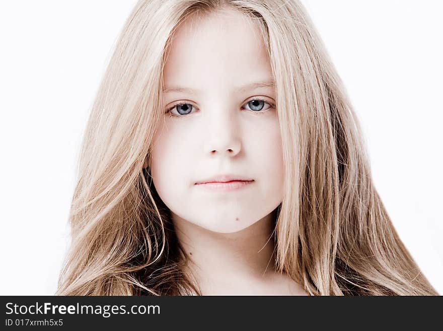 A portrait of a young cute girl in the studio. A portrait of a young cute girl in the studio