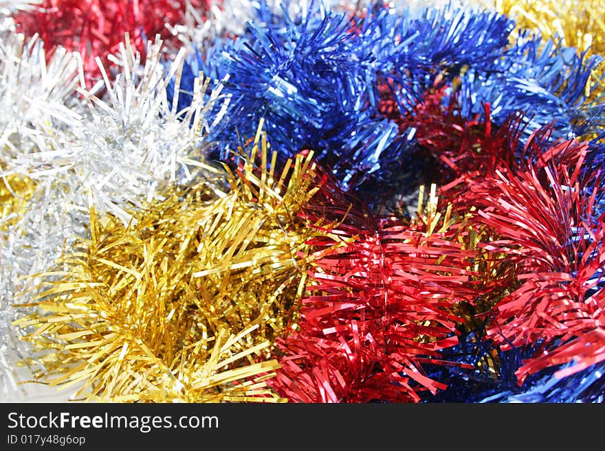 Red, yellow, dark blue and silvery ornaments on a New Year tree. Red, yellow, dark blue and silvery ornaments on a New Year tree