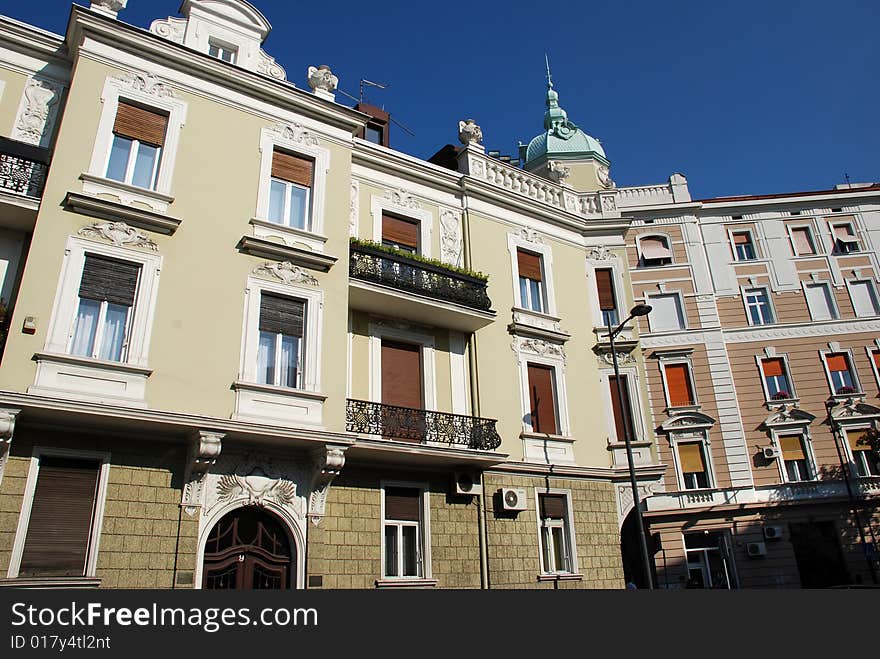 Classic building architecture details over blue sky. Classic building architecture details over blue sky