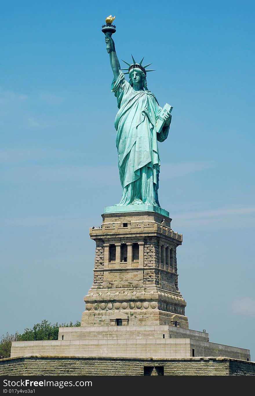 Statue of Liberty fragment over blue sky