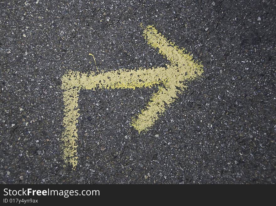 An arrow painted on the asphalt. An arrow painted on the asphalt.