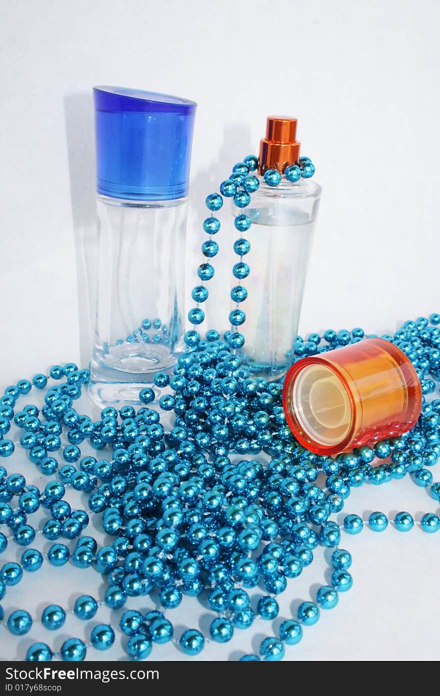 Perfumery water is decorated by a dark blue beads. Perfumery water is decorated by a dark blue beads