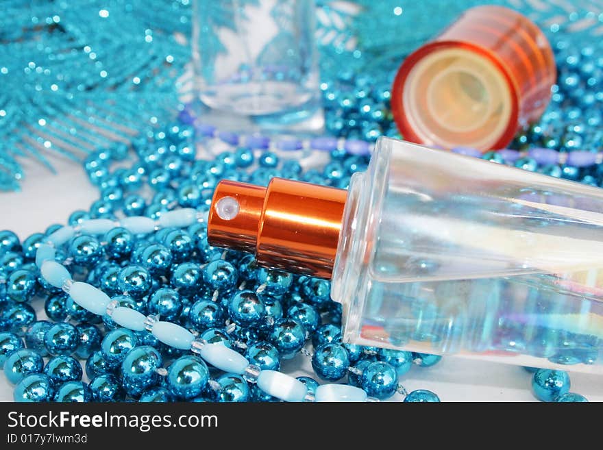 Perfumery water is decorated by a dark blue beads. Perfumery water is decorated by a dark blue beads