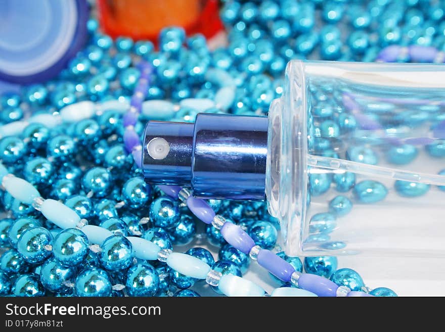 Perfumery water is decorated by a dark blue beads. Perfumery water is decorated by a dark blue beads