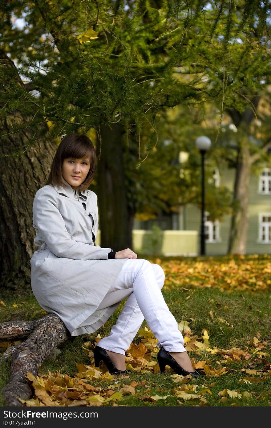 A Young Woman In The Autumn Park