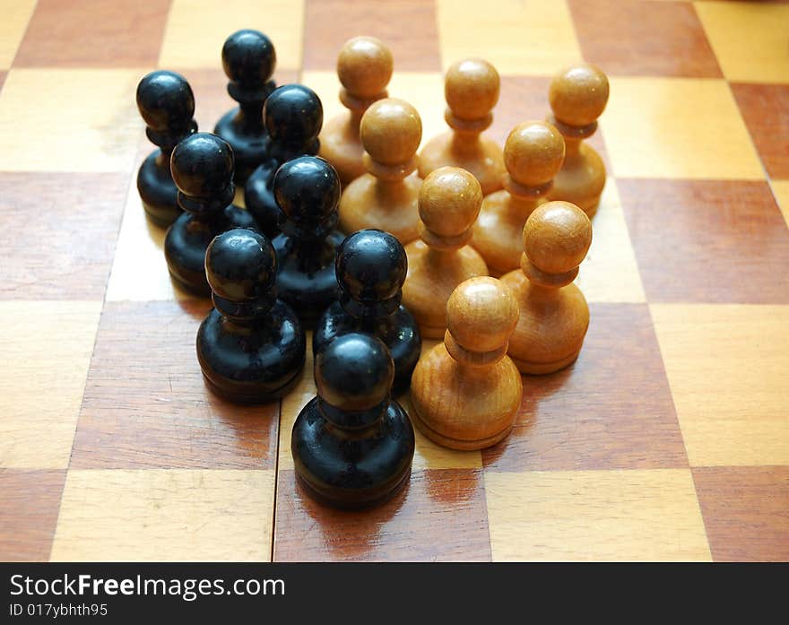 Vintage pawns on chess board