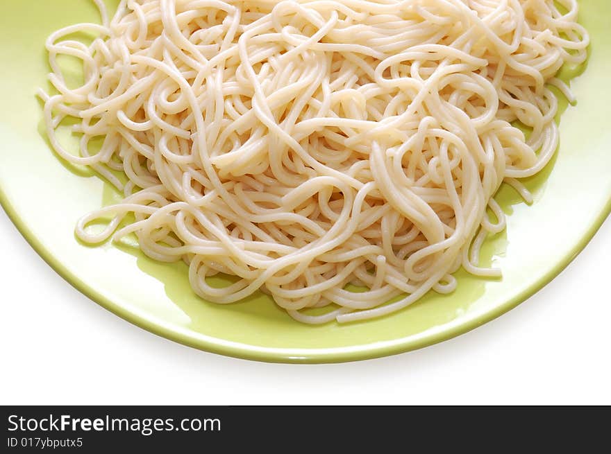 Italian spaghetti on green plate