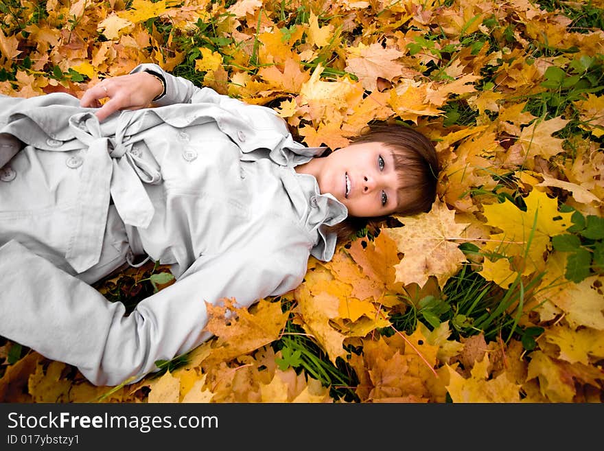 Young woman and autumn leaves horizontal