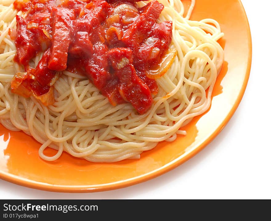 Spaghetti with meat in ketchup on the orange plate