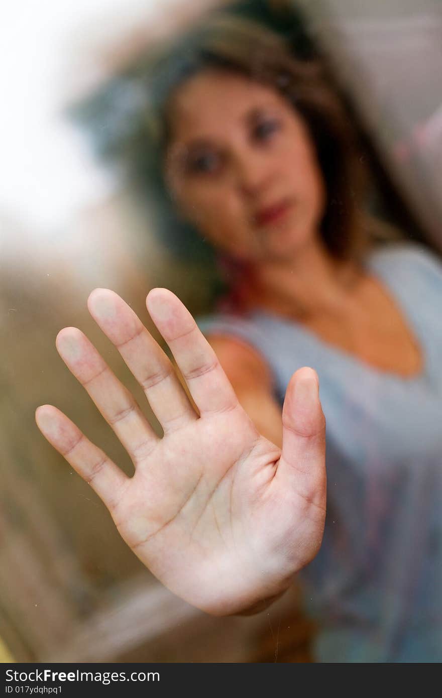 Nice woman stands outside the door.