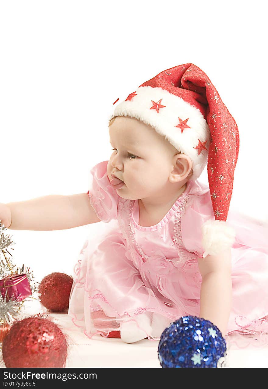 Baby in red hat on white ground. Baby in red hat on white ground