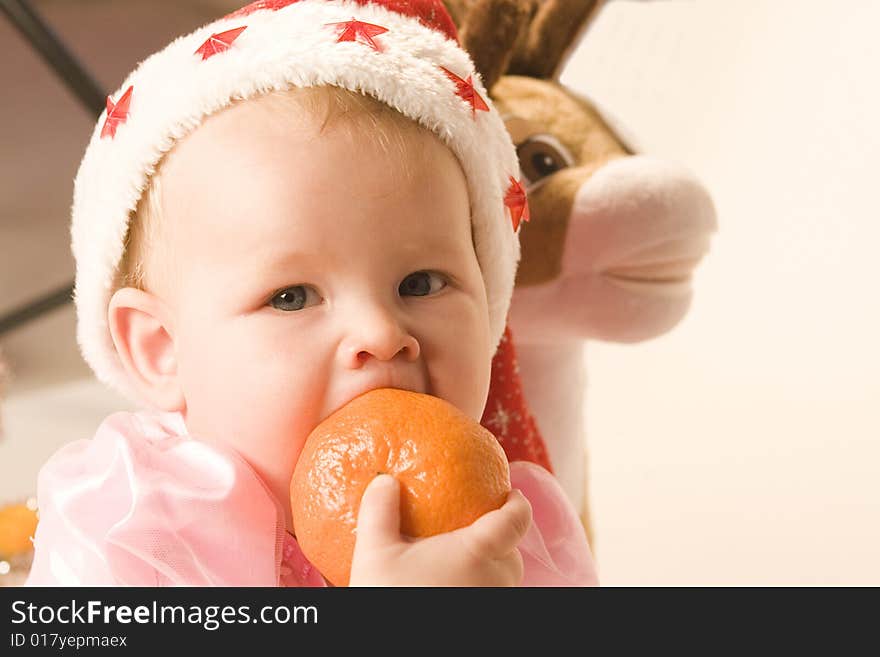 Baby in red hat on white ground. Baby in red hat on white ground