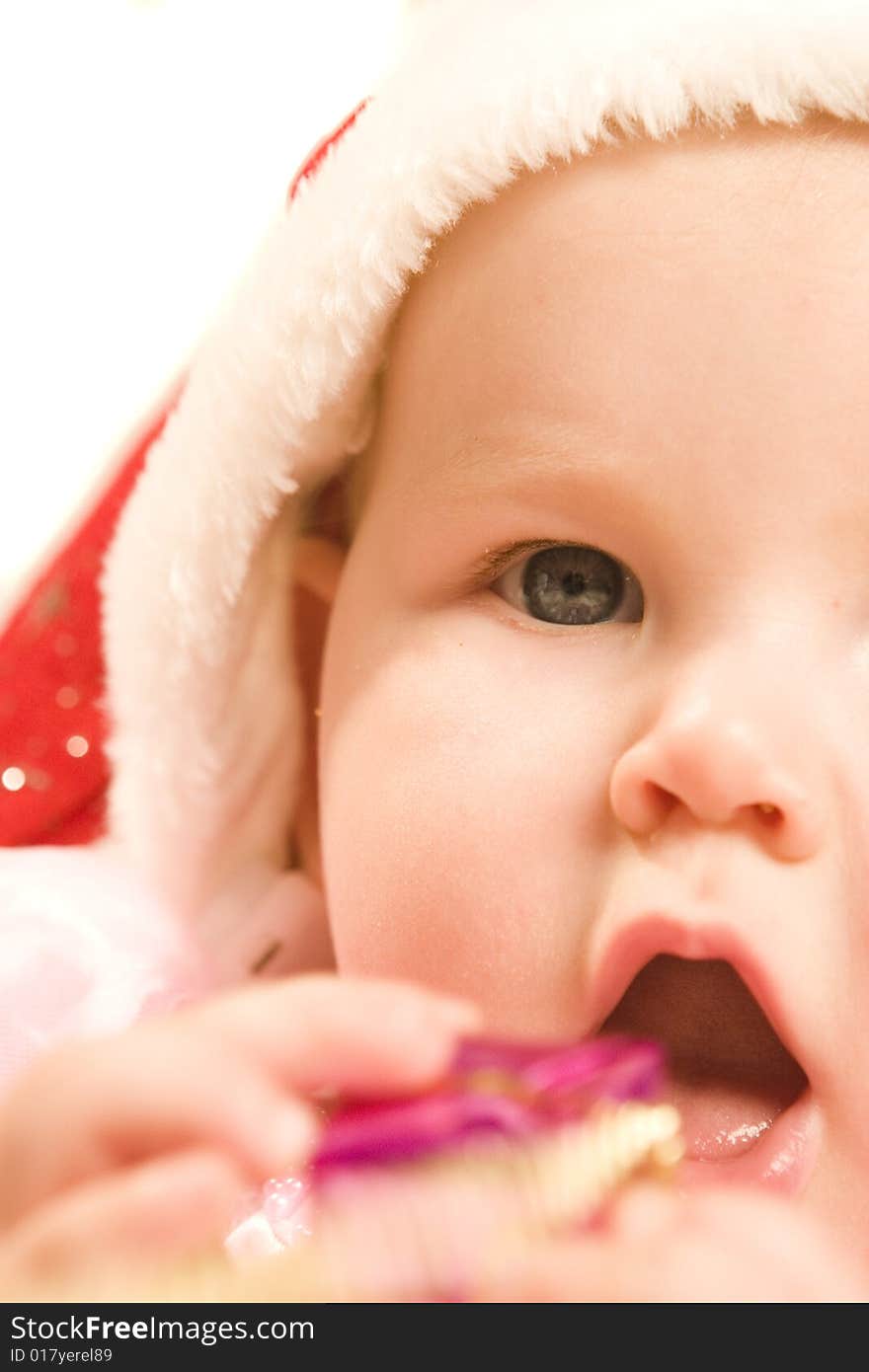 Baby in red hat on white ground. Baby in red hat on white ground