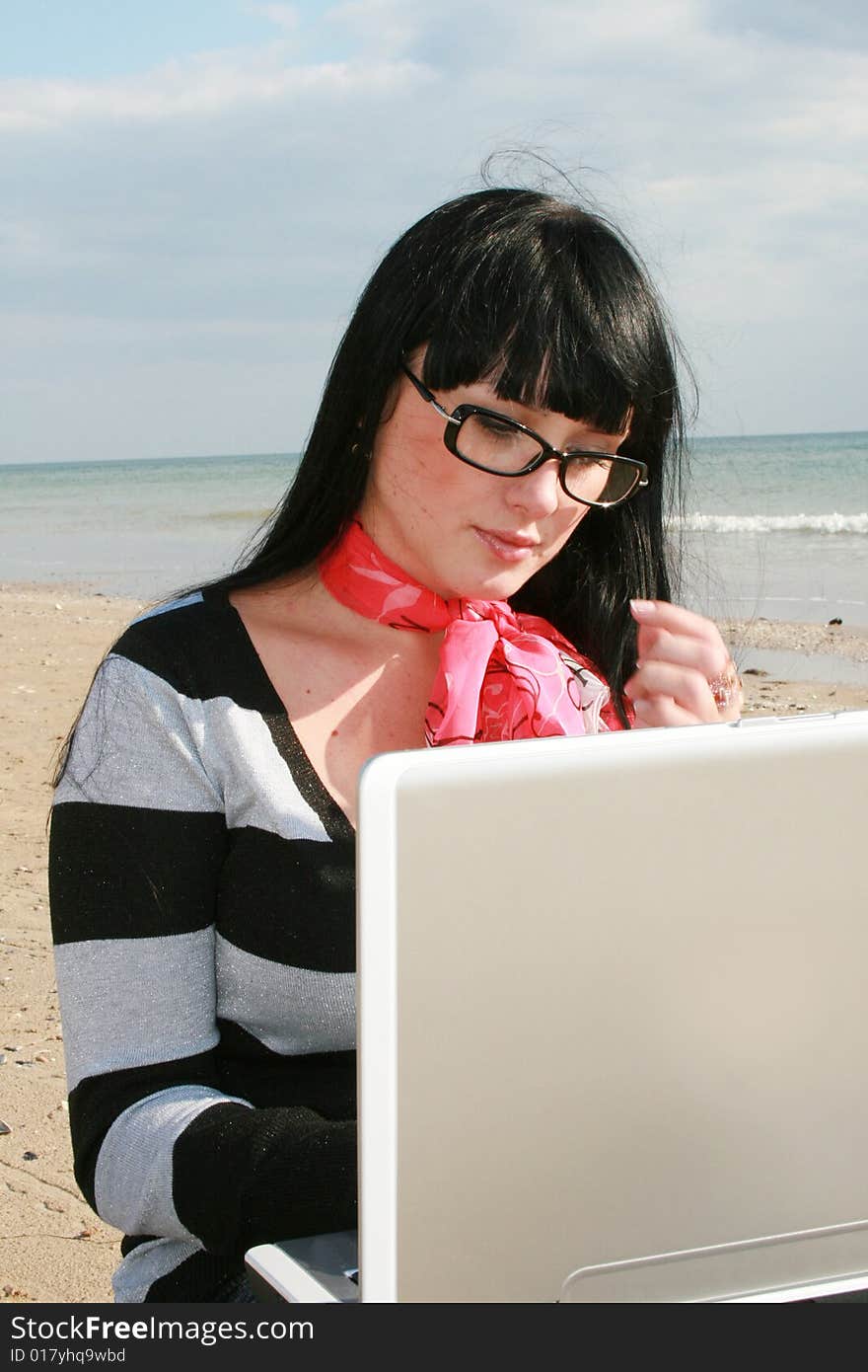 Woman On Beach With Laptop