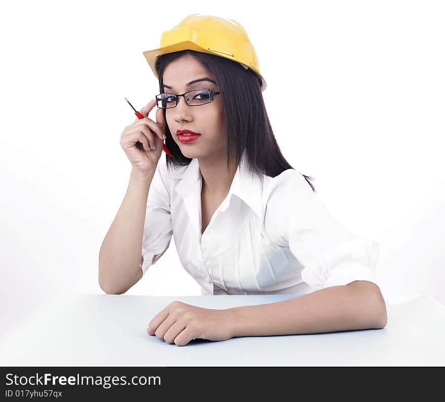 Asian girl with a yellow factory helmet