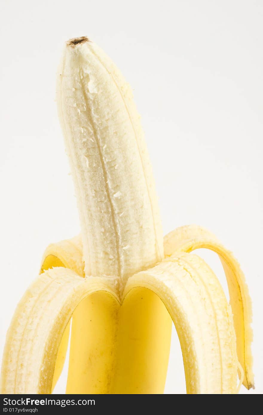 One cleared banana isolated on white background closeup