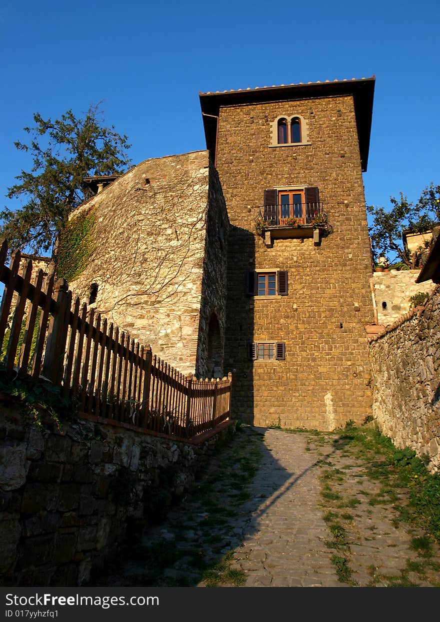 A wonderful glimpse of a fench and an old house in Florence countryside. A wonderful glimpse of a fench and an old house in Florence countryside