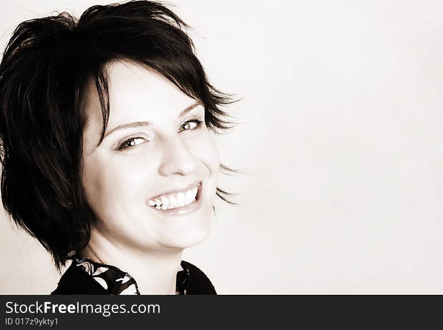 Studio shot of female brunette, head and shoulders. Studio shot of female brunette, head and shoulders