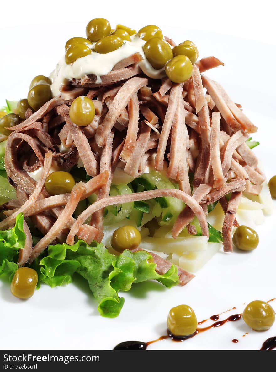 Green Peas and Meat Salad Served with Salad Leaves and Sauce. Isolated on White Background