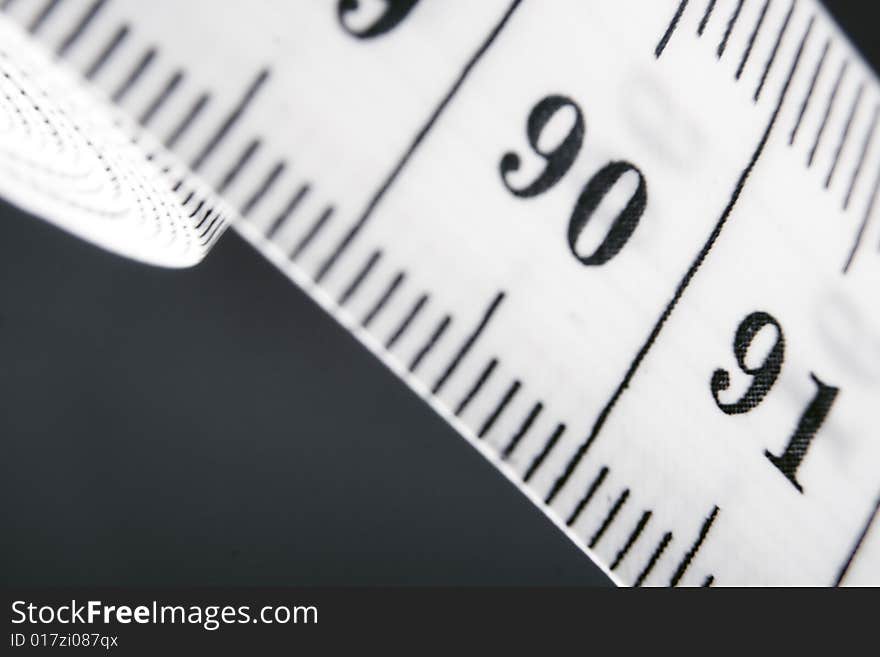 Measuring tape isolated on grey. Measuring tape isolated on grey.