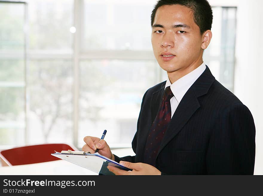 A young asian working in office