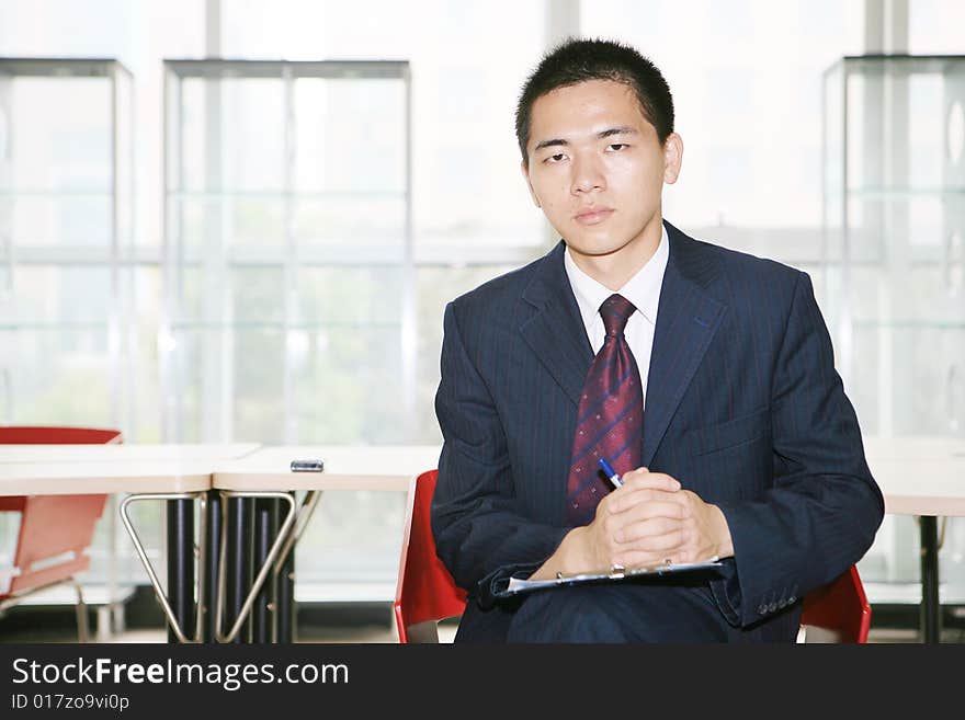 A young asian working in office