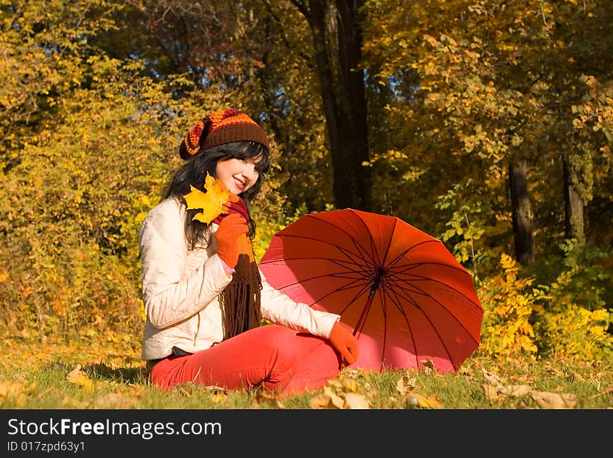 Young pretty woman in the autumn park. Young pretty woman in the autumn park