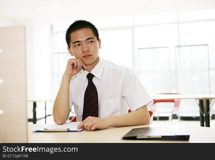 A young asian working in office