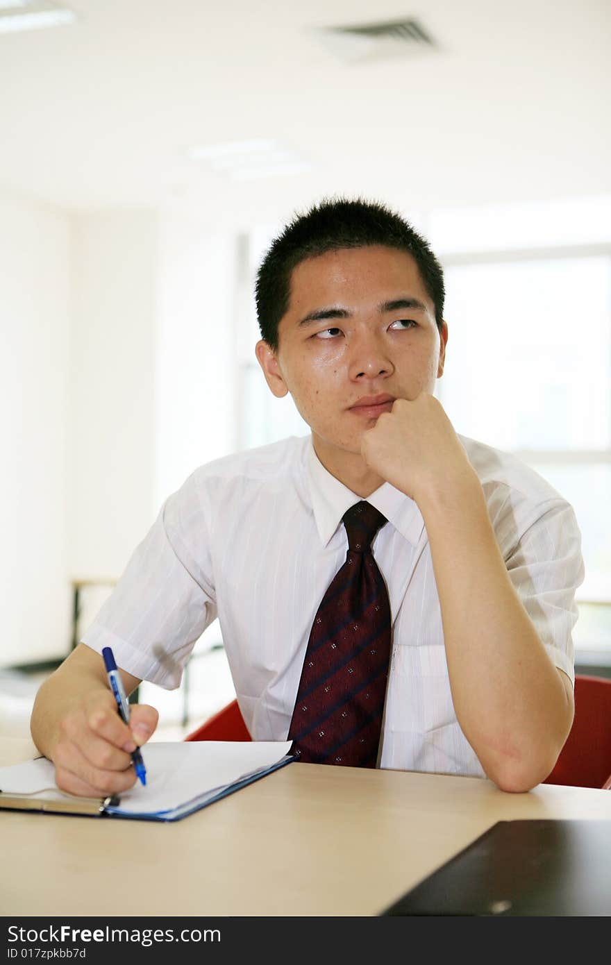 Young Asian Working In Office